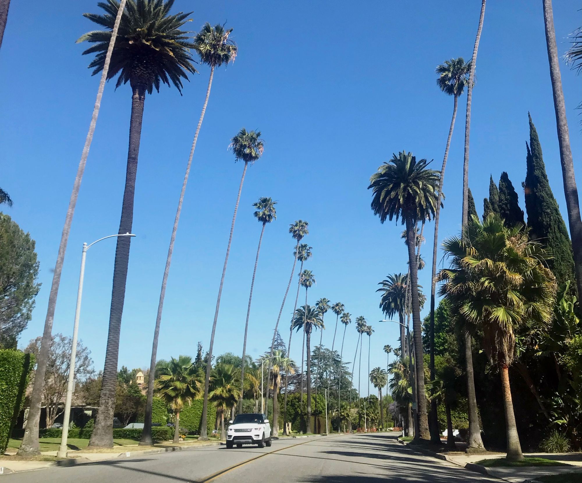 Not depicted: the LA traffic, but a Range Rover cruising down Sunset Blvd. Be sure to visit this iconic road!