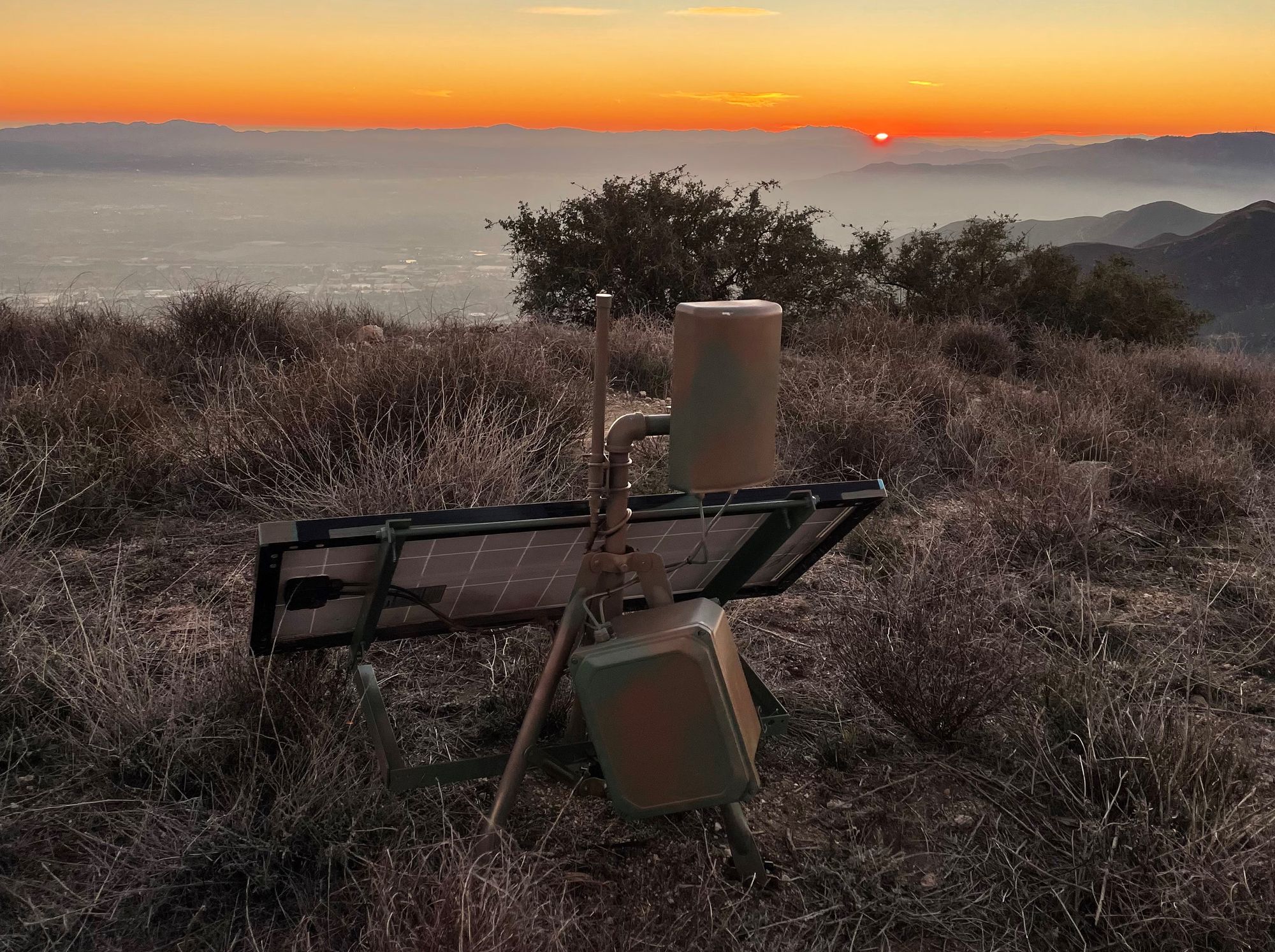 The fourth and final version of the Helium Network Station. This specific station is fitted with an additional high-gain cellular antenna to improve signal strength and spray-painted camouflage to deter hikers and explorers who get too hands-on with the station.
