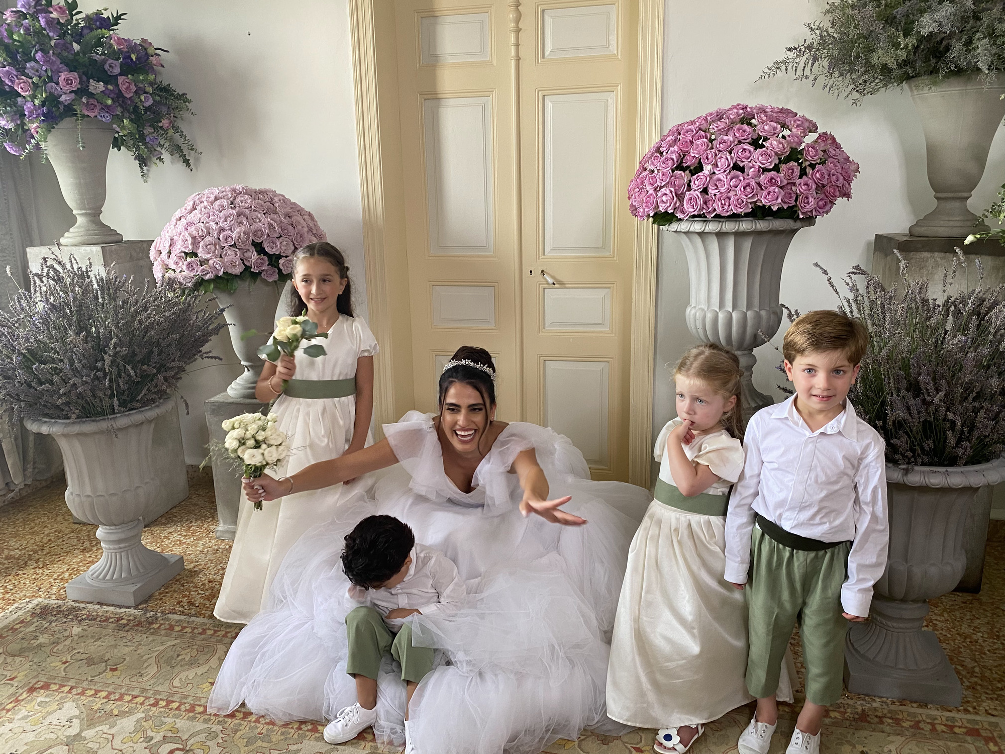 Natalie with the adorable flower girls + ring bearers 